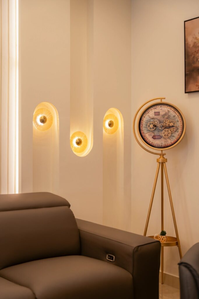 living room interior design with niche wall lights and brass floor clock